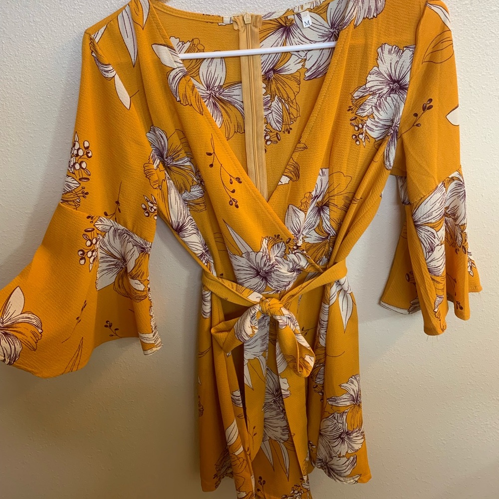 Romper. Size medium. Yellow with white flowers